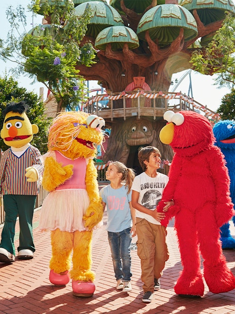 Children interacting with costumed characters at PortAventura World, Barcelona.