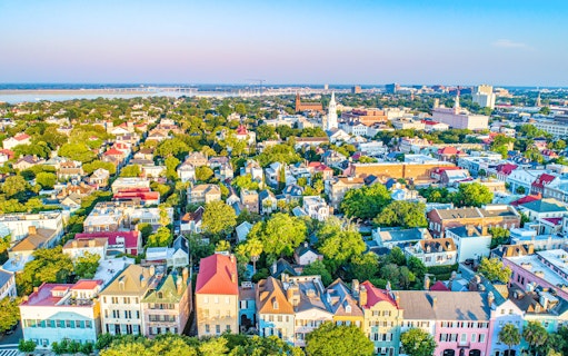 Aerial view of Rainbow Row's colorful historic houses in downtown Charleston, South Carolina.