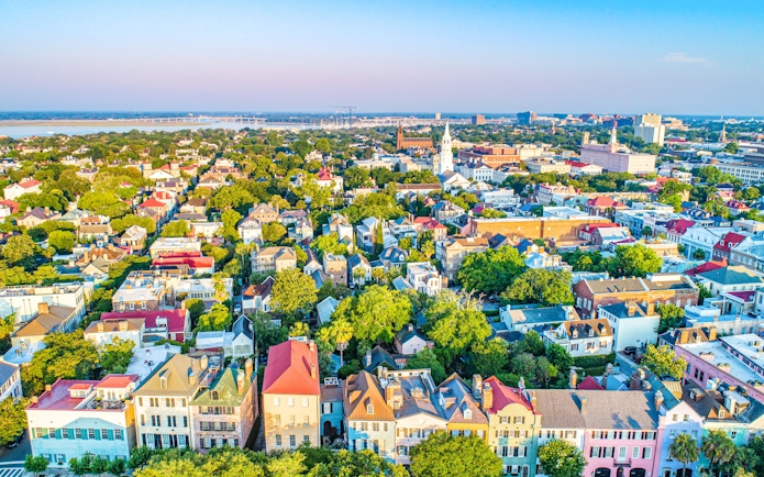 Aerial view of Rainbow Row's colorful historic houses in downtown Charleston, South Carolina.