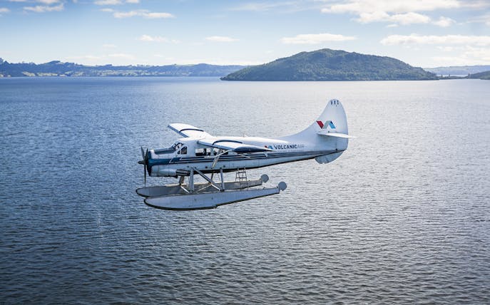 Floatplane flying over lake during guided tour from Rotorua to Mt Tarawera and Waimangu Thermal Valley.