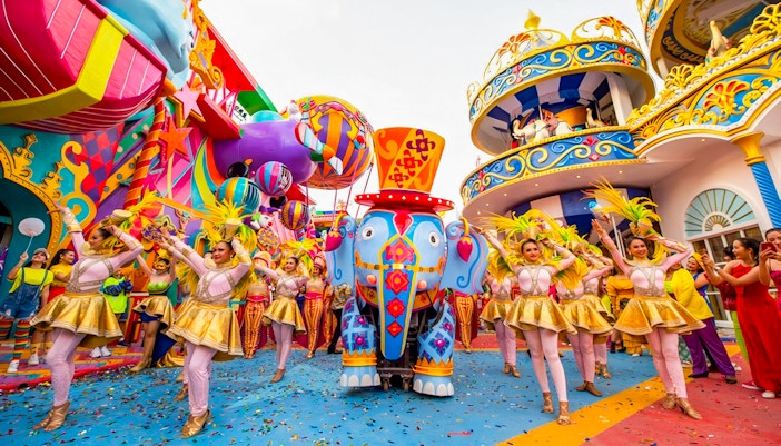 Carnival Magic Phuket parade with vibrant floats and performers, featuring "Elephant in the Room" attraction.