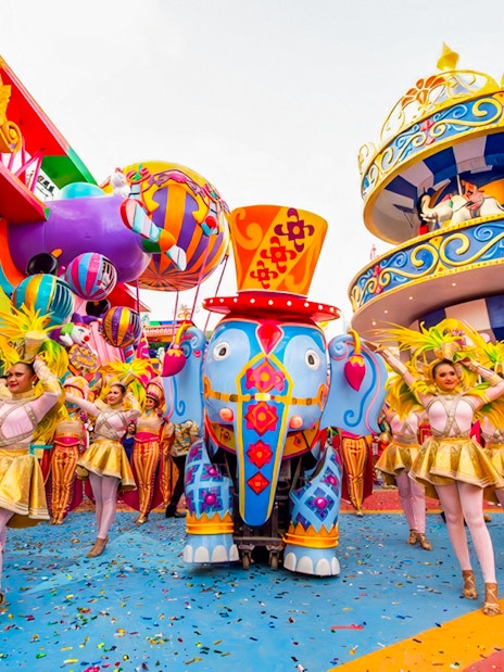 Carnival performers and colorful elephant float at Carnival Magic, Phuket.