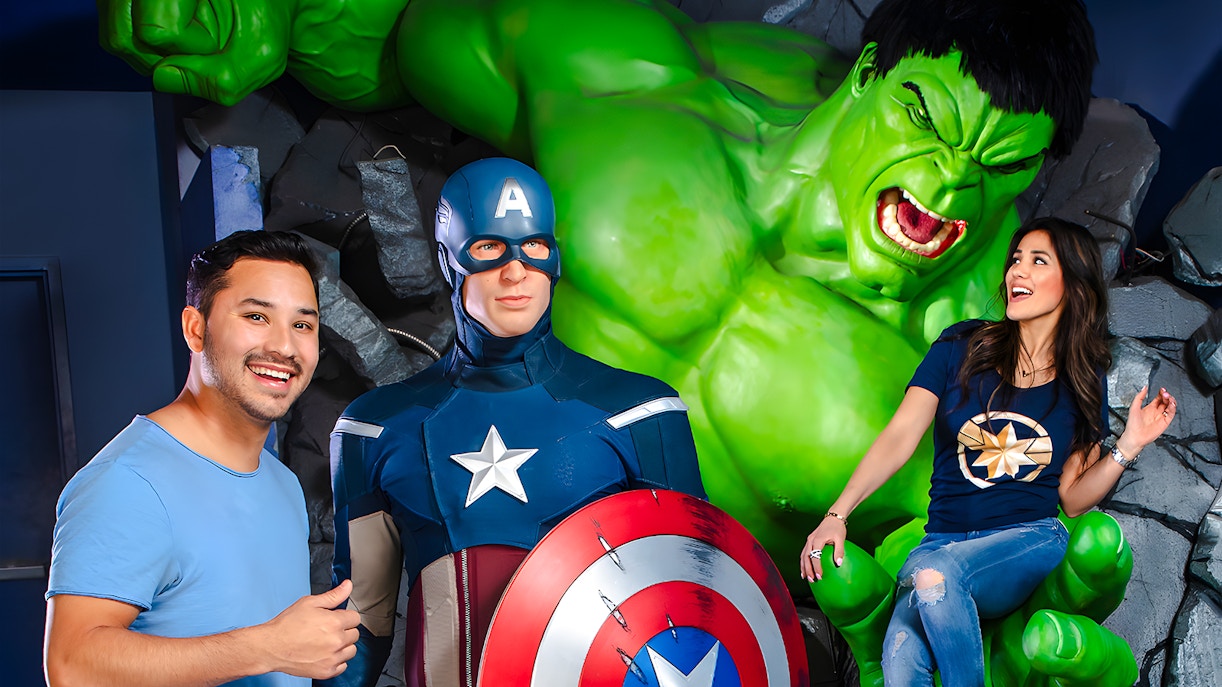 Captain America and Hulk wax figures at Madame Tussauds Las Vegas with visitors.