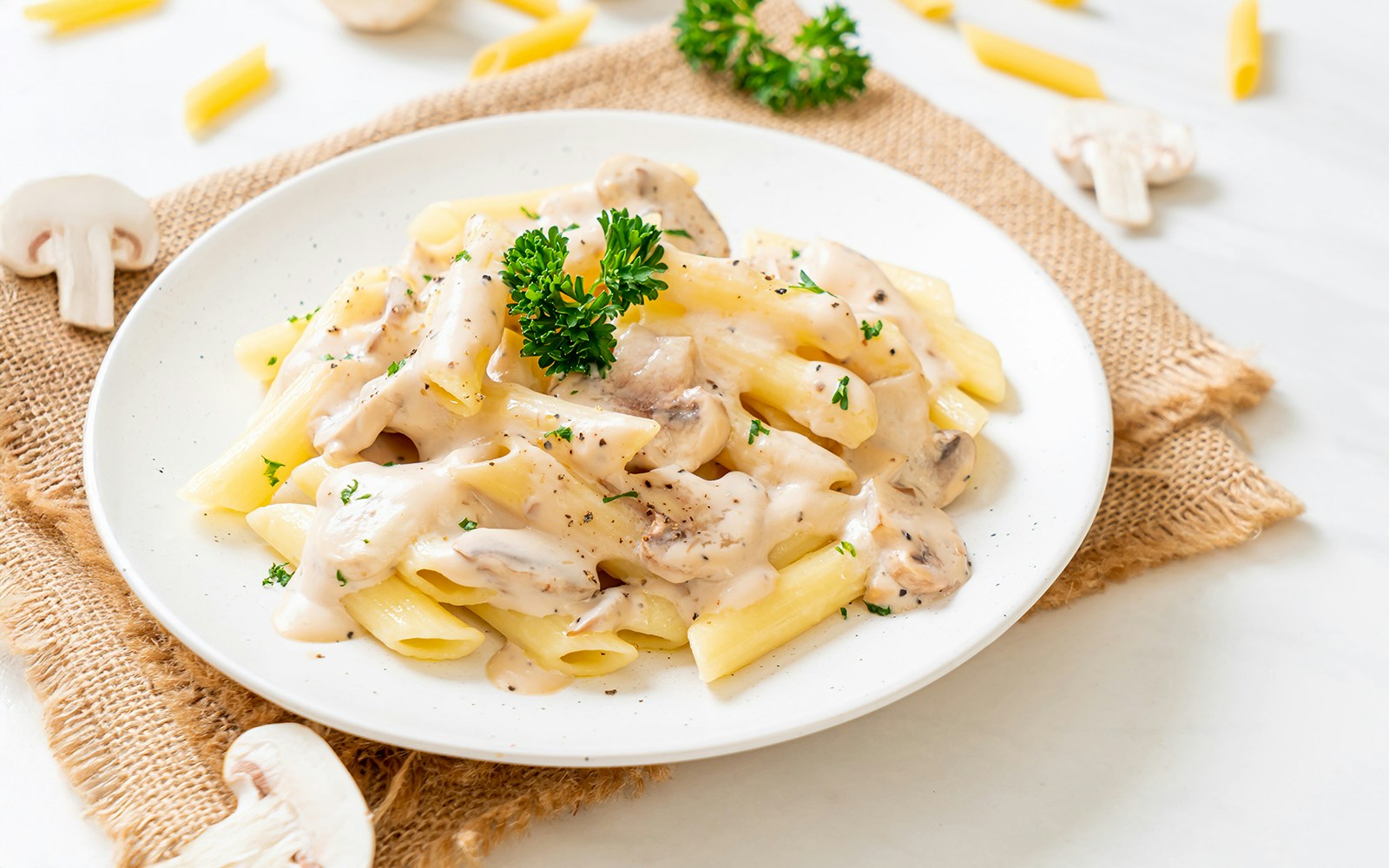 Penne with cheese sauce pasta on a plate