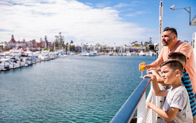 Guests enjoying the view from the dock on the Long Beach Signature Dinner Cruise.