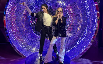 Wax figures at Madame Tussauds Budapest with a disco-themed backdrop.