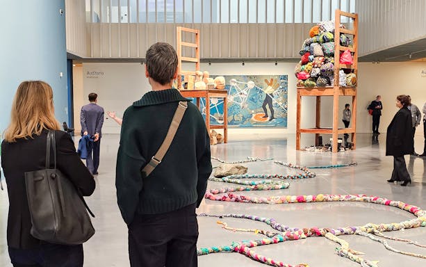 Visitors observing art installations at Picasso's Birthplace Museum.