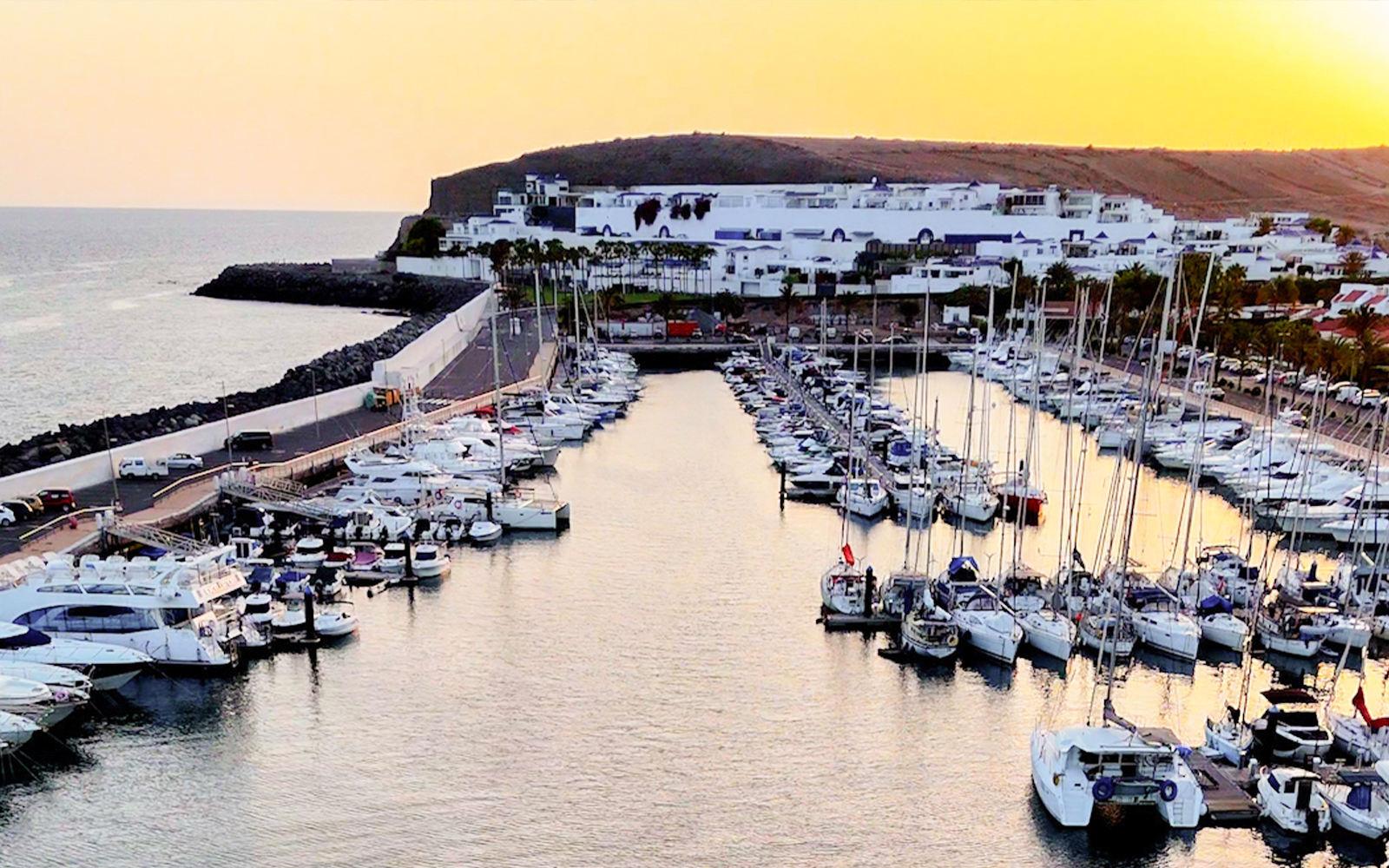 Marina with yachts at sunset during Private Dolphin & Whale Watching Cruise, Gran Canaria.