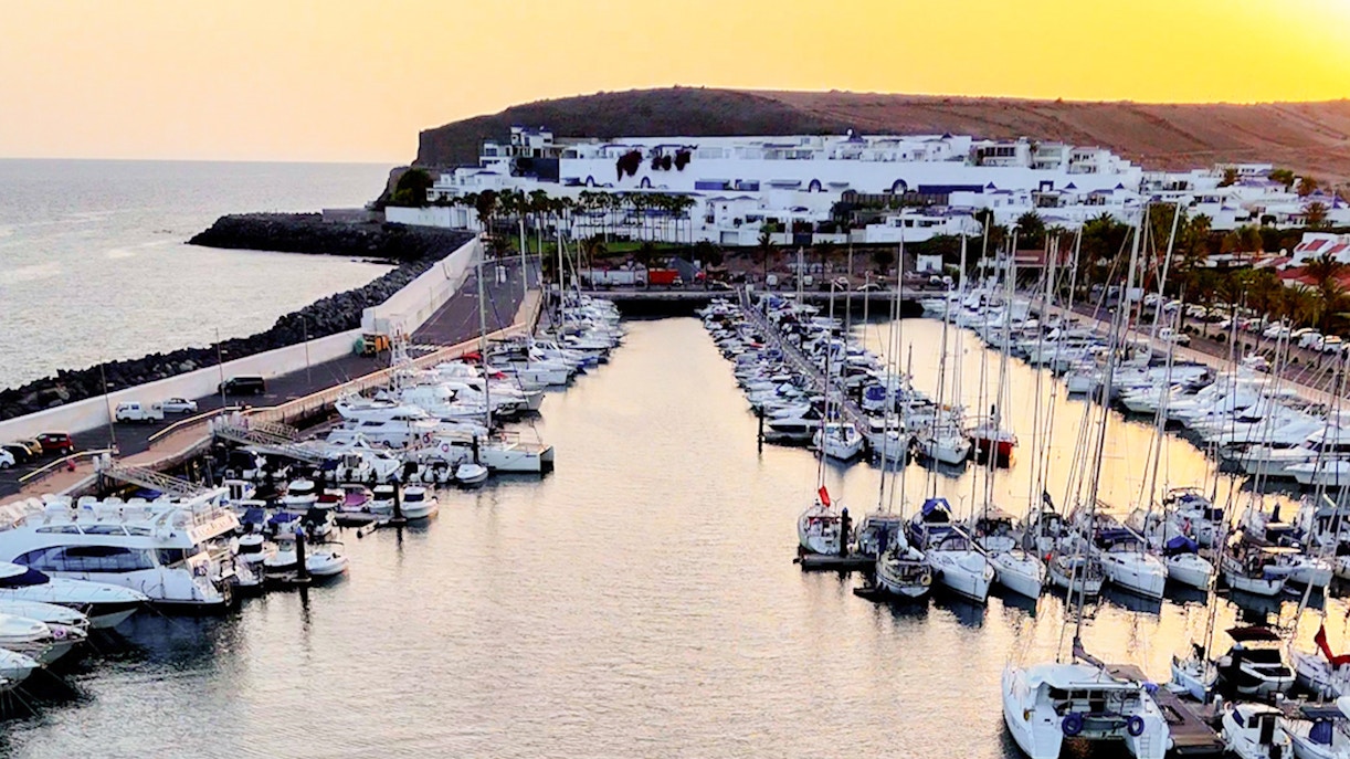 Marina with yachts at sunset during Private Dolphin & Whale Watching Cruise, Gran Canaria.