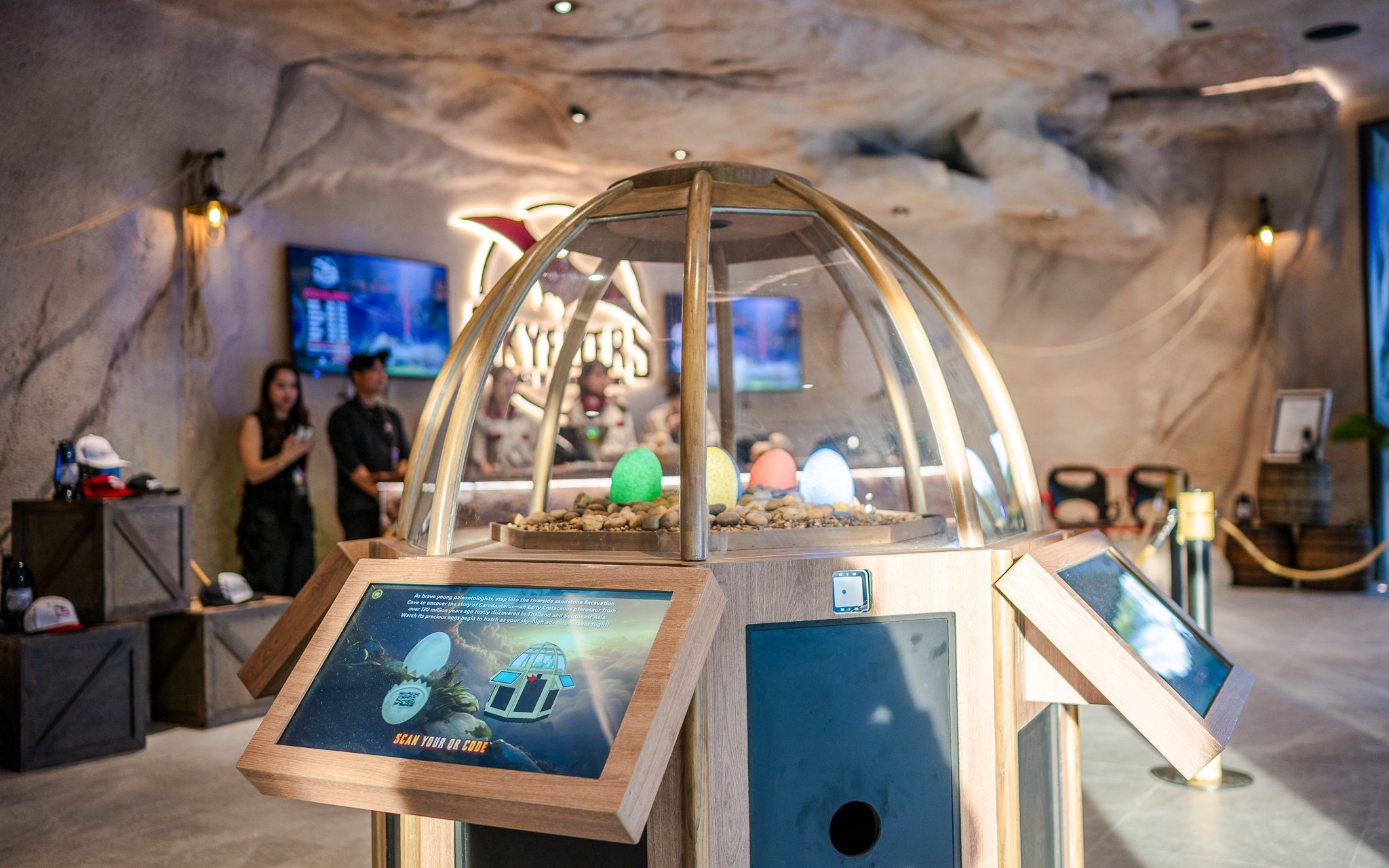 Interactive exhibit at SkyFlyers Asiatique Bangkok with colorful eggs under a glass dome.