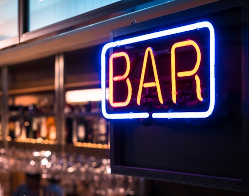 Neon bar sign at Bridge Theatre, London.