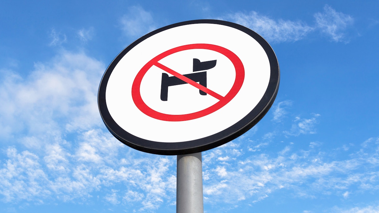 No pets allowed sign at Therme Bucuresti against blue sky.