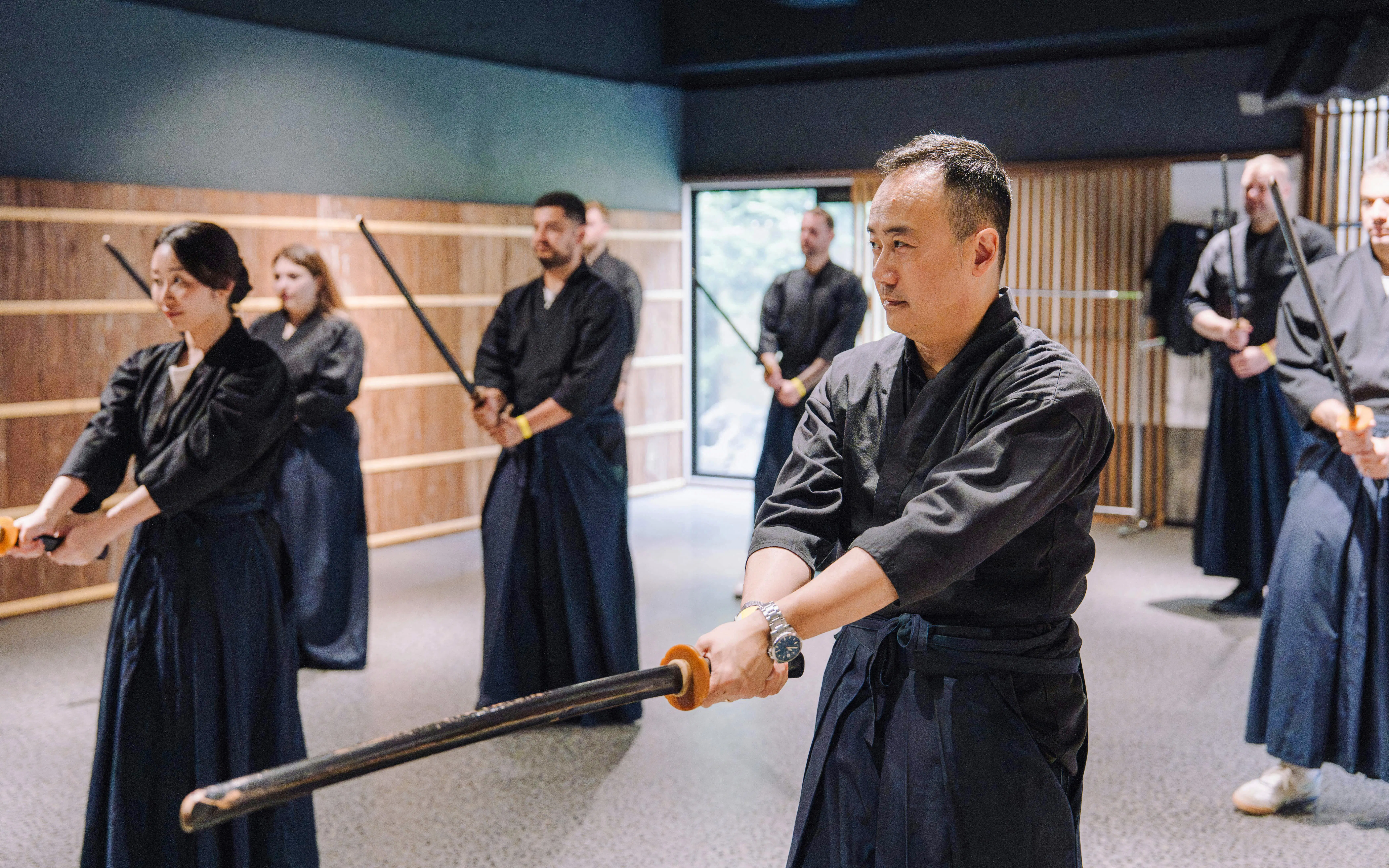 Participants practicing sword techniques at Samurai Museum Tokyo in Shinjuku.