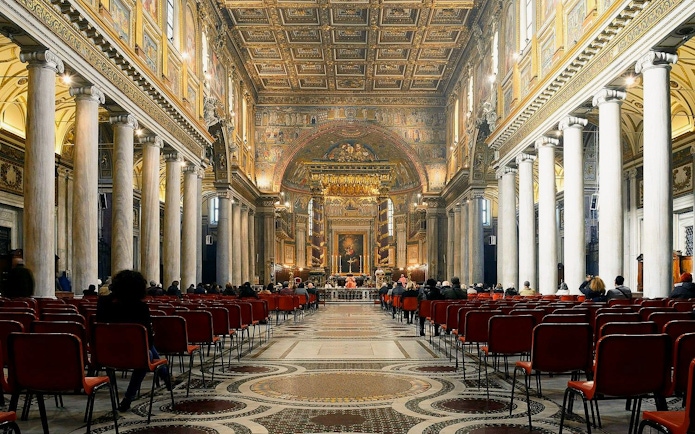Interior of Papal Basilica of Santa Maria Maggiore, Rome, with ornate ceiling and columns.