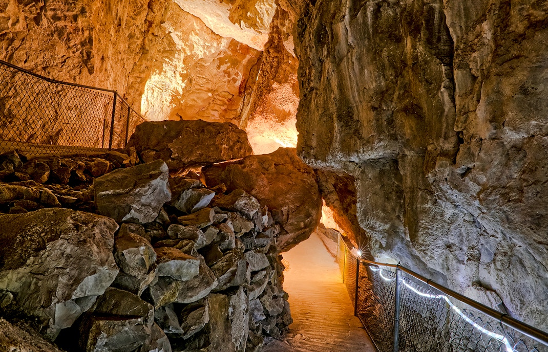 Rock arch formation inside Grand Canyon Caverns, Arizona, showcasing natural geological features.