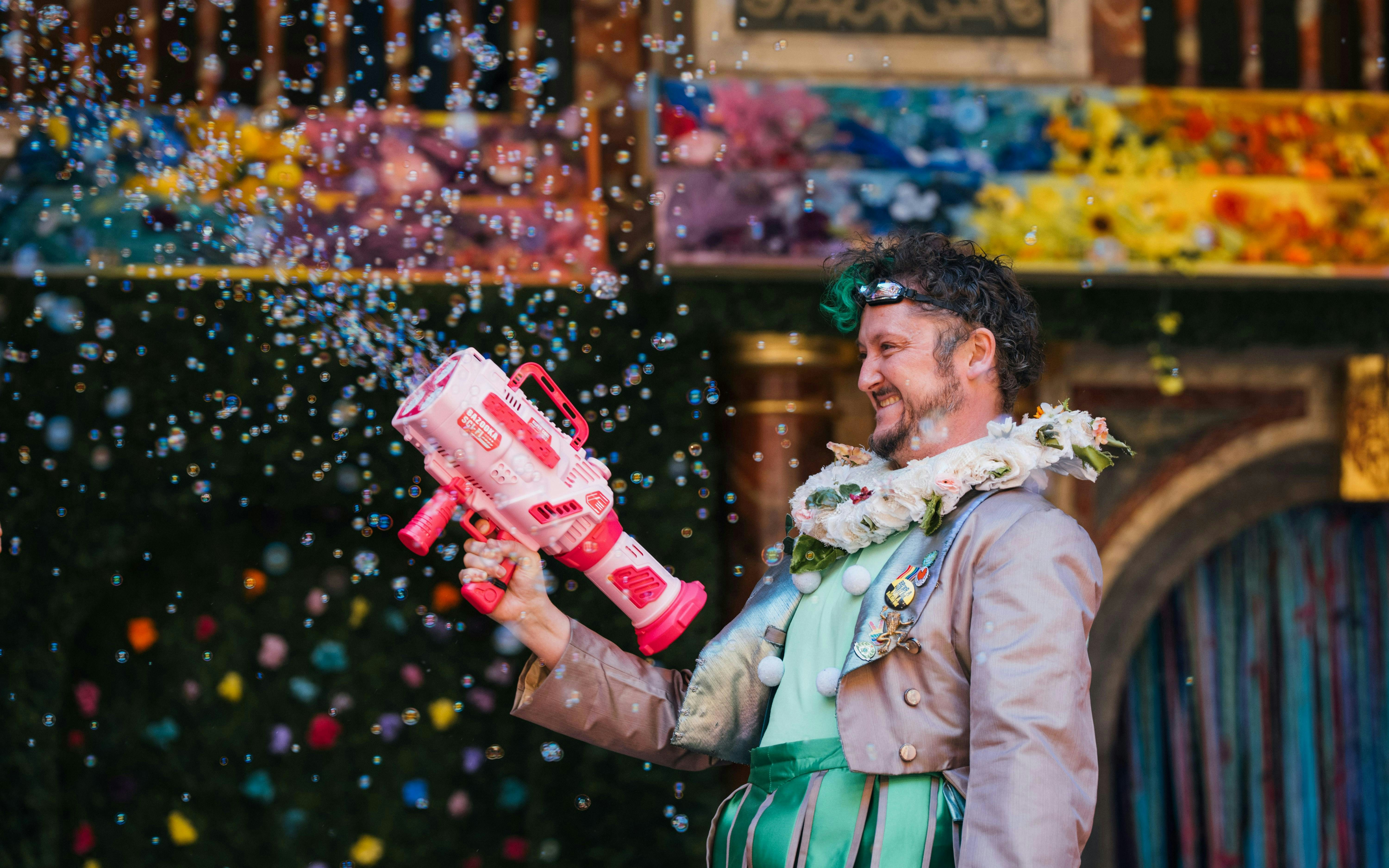Performer with bubble gun in A Midsummer Night’s Dream, Westend stage.