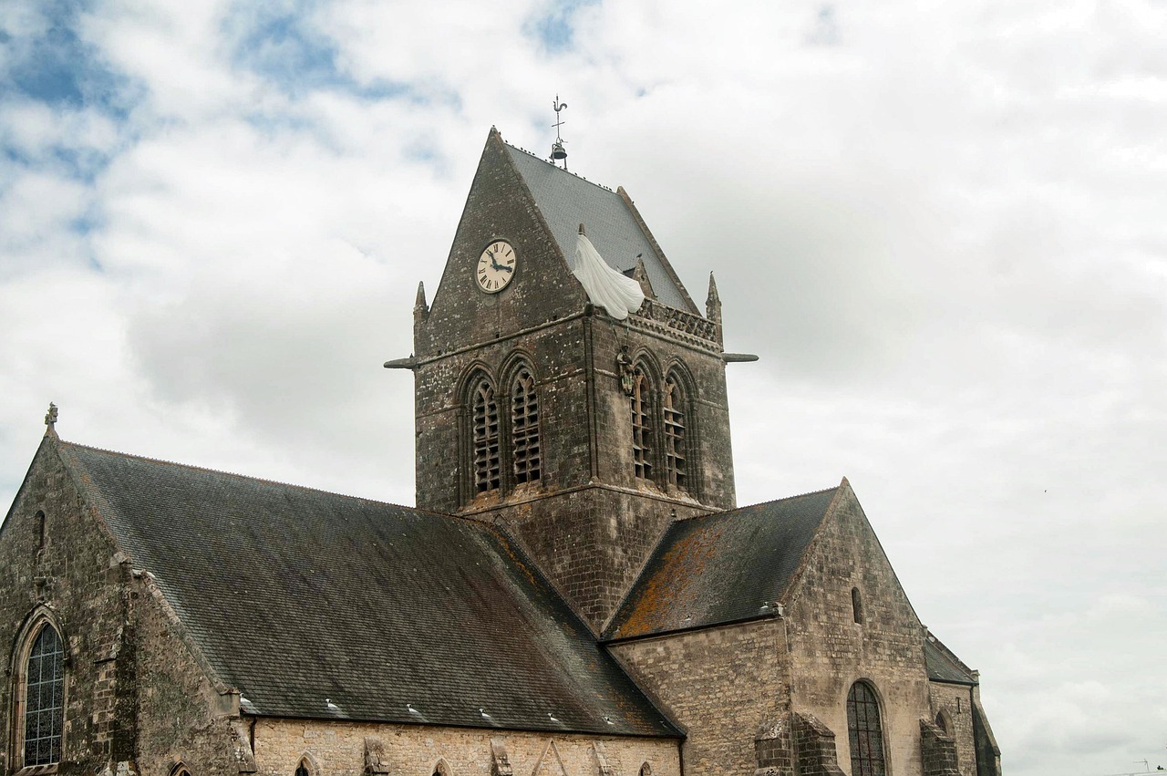 Sainte-Mère-Église church tower with paratrooper mannequin, Normandy.