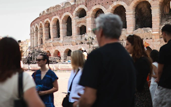 Verona Arena with tourists during Romeo & Juliet food tour.