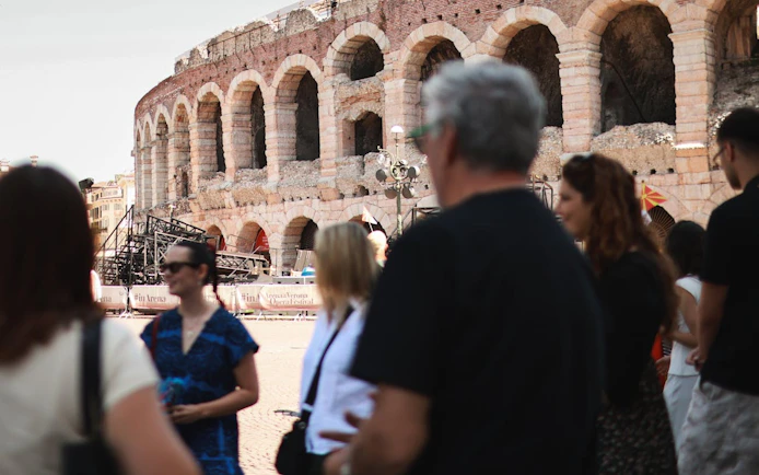 Verona Arena with tourists during Romeo & Juliet food tour.