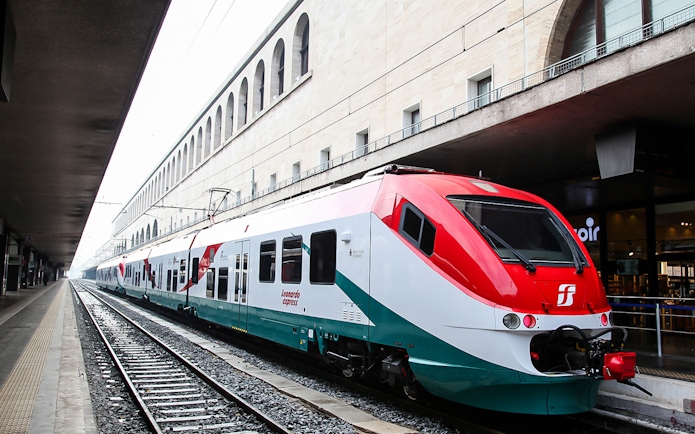 Leonardo Express train at Rome Termini Station platform, connecting to Fiumicino Airport.