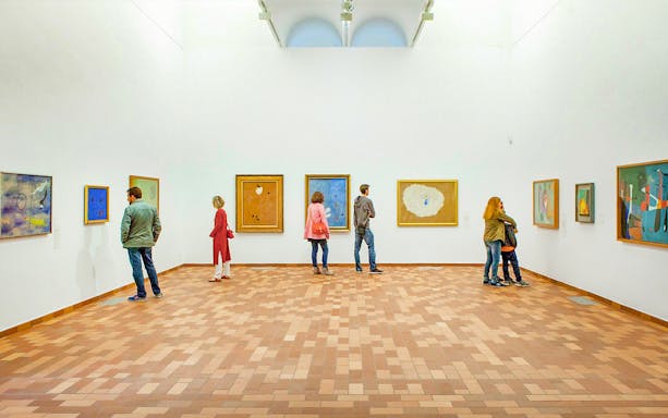 Visitors viewing Joan Miró paintings at the Joan Miró Foundation in Barcelona.