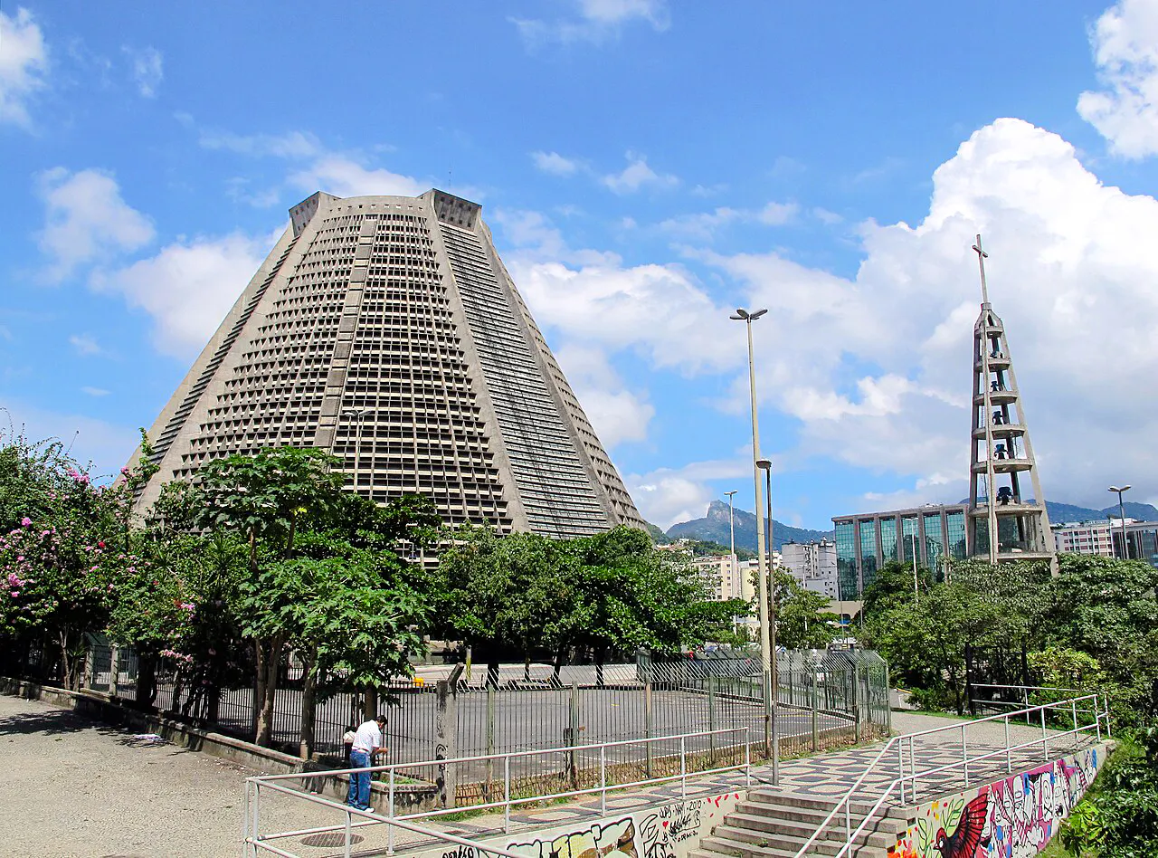 Cathedral of Rio de Janeiro with bell tower and cityscape in the background.