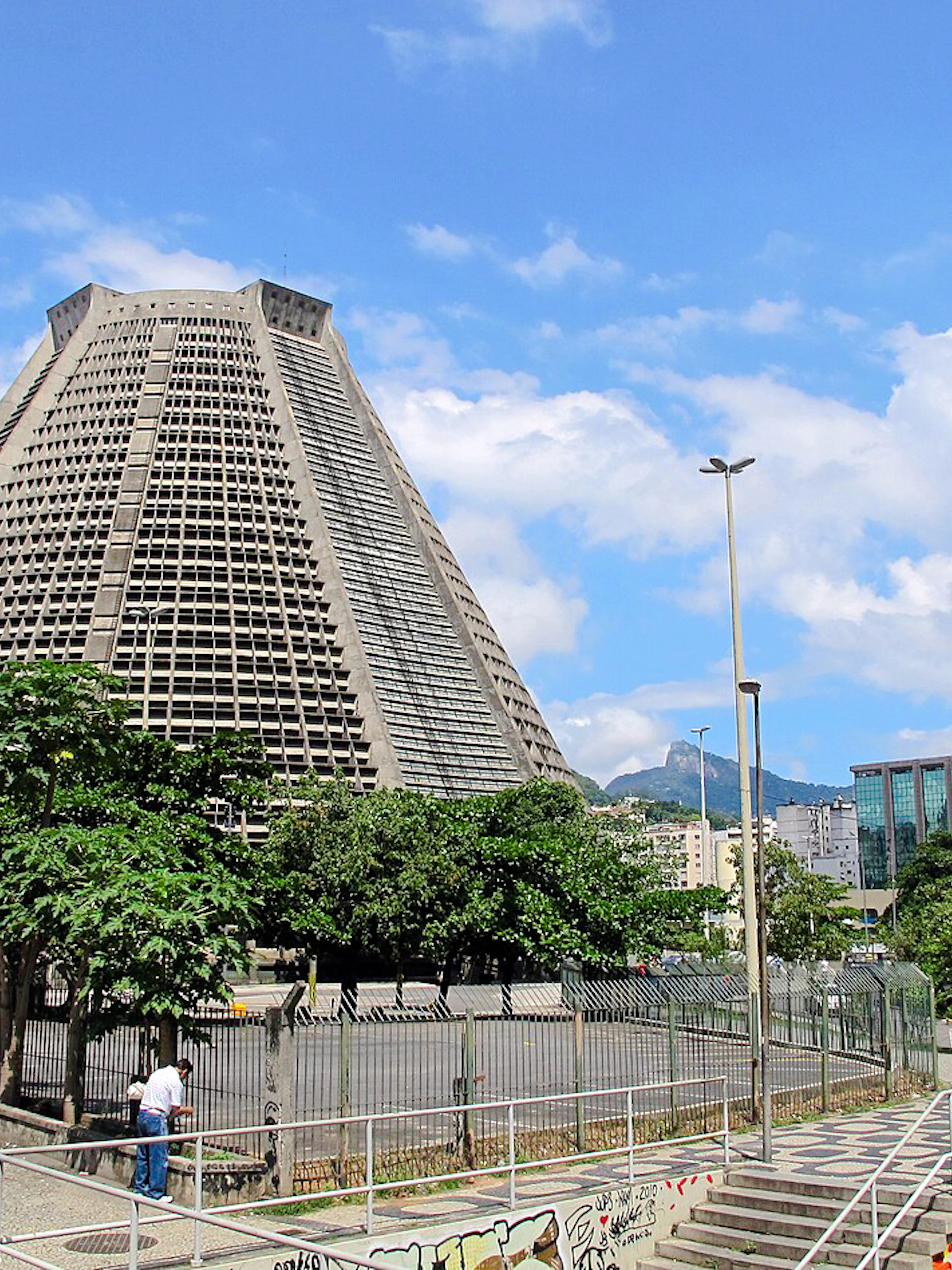 Cathedral of Rio de Janeiro with bell tower and cityscape in the background.
