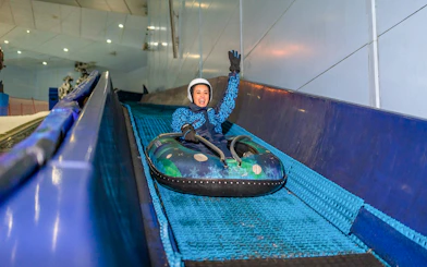 Guest enjoying the 'Mountain Thriller' ride at Ski Dubai.