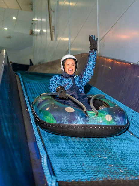 Guest enjoying the 'Mountain Thriller' ride at Ski Dubai.