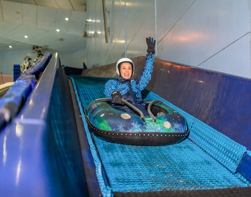 Guest enjoying the 'Mountain Thriller' ride at Ski Dubai.