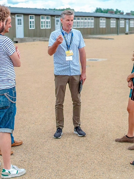 Tour guide leading guests at Sachsenhausen Concentration Camp Memorial.