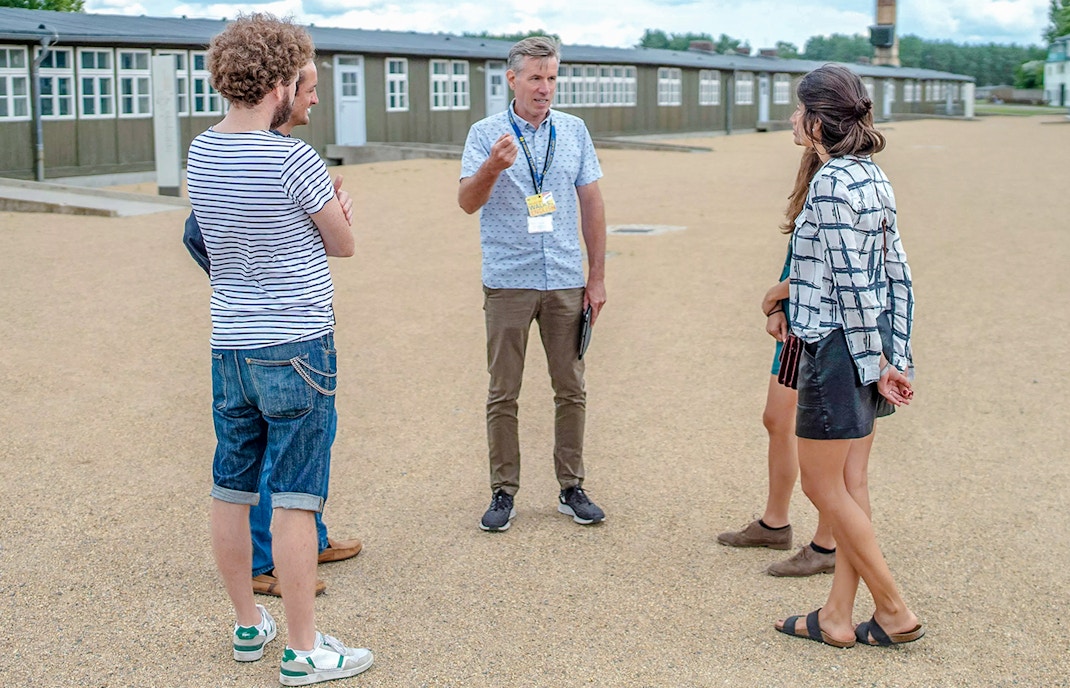 Tour guide leading guests at Sachsenhausen Concentration Camp Memorial.