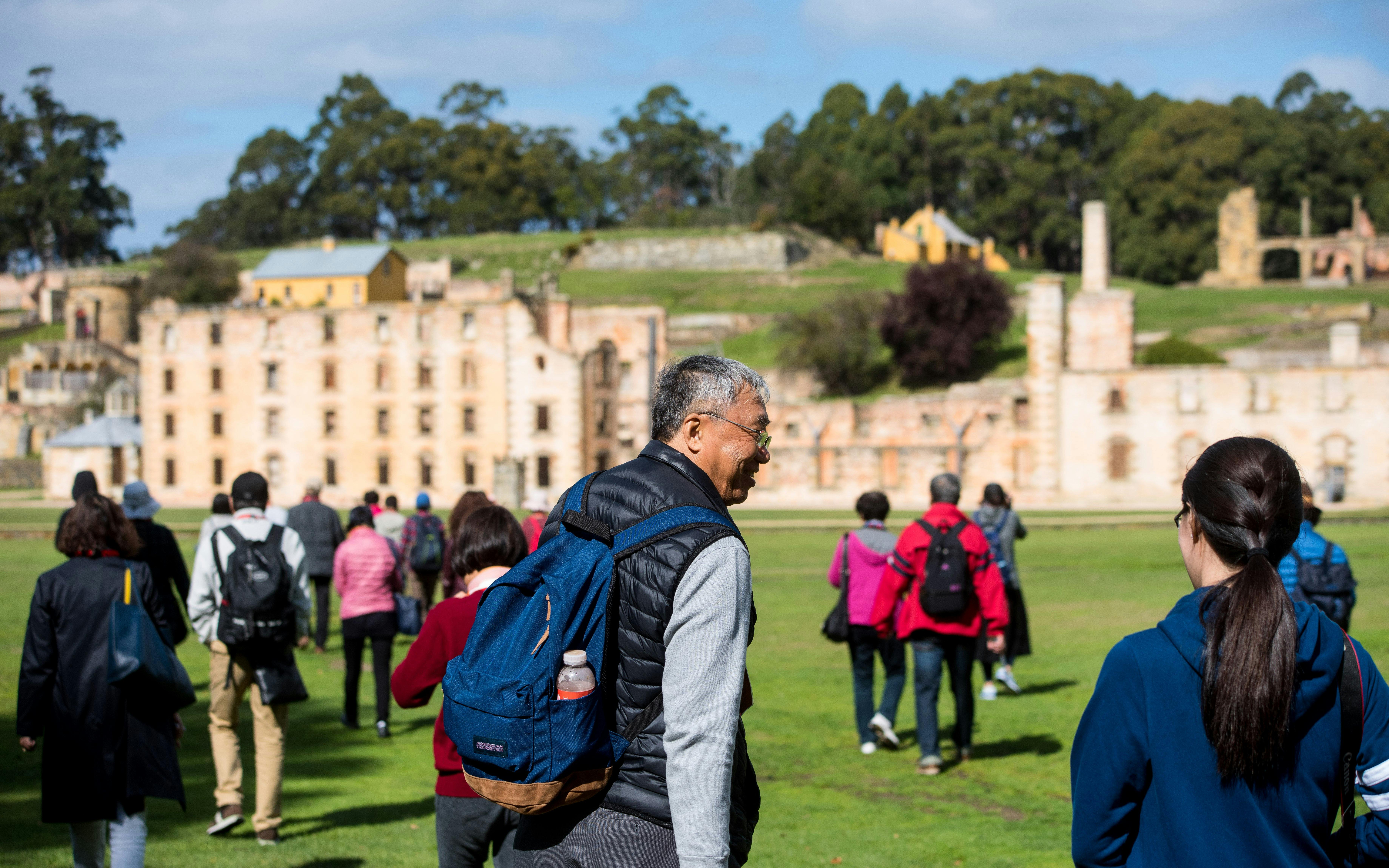 Tour group exploring historic ruins at Port Arthur, Tasman Peninsula.