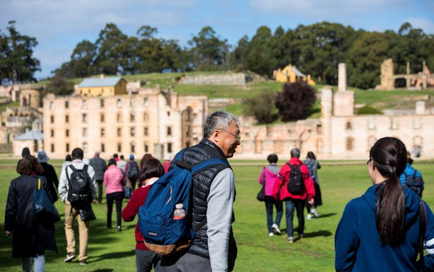 Tour group exploring historic ruins at Port Arthur, Tasman Peninsula.