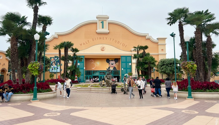 Walt Disney Studios entrance at Disneyland Paris with Mickey Mouse mural.