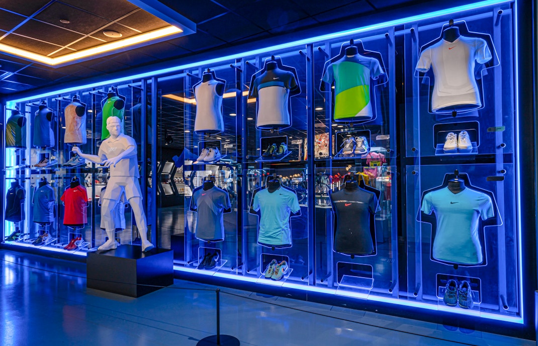 Visitors exploring interactive exhibits at Rafa Nadal Museum Xperience, matching outfits with tennis memorabilia.