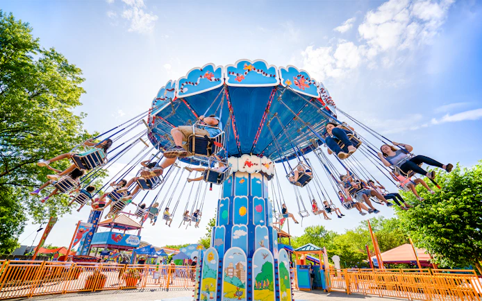 Visitors enjoying a swing ride at Sesame Place Philadelphia.