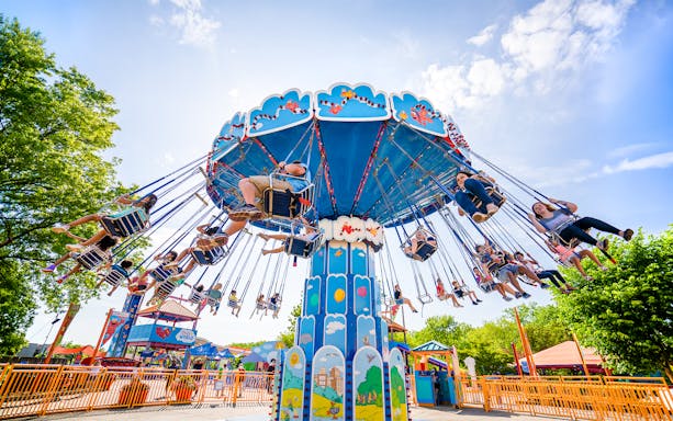 Visitors enjoying a swing ride at Sesame Place Philadelphia.