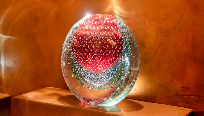Murano glass sculpture with red and green patterns, Murano, Venice, Italy.