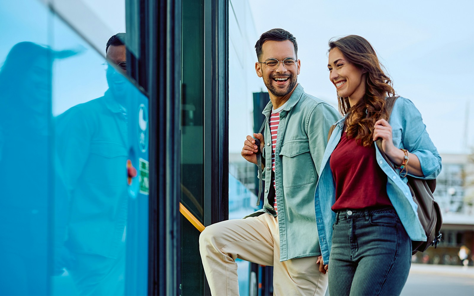 Couple boarding a bus for a city tour.