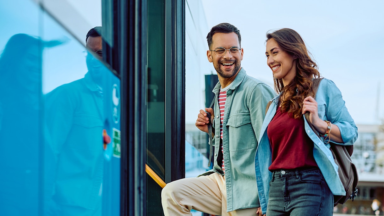 Couple boarding a bus for a city tour.