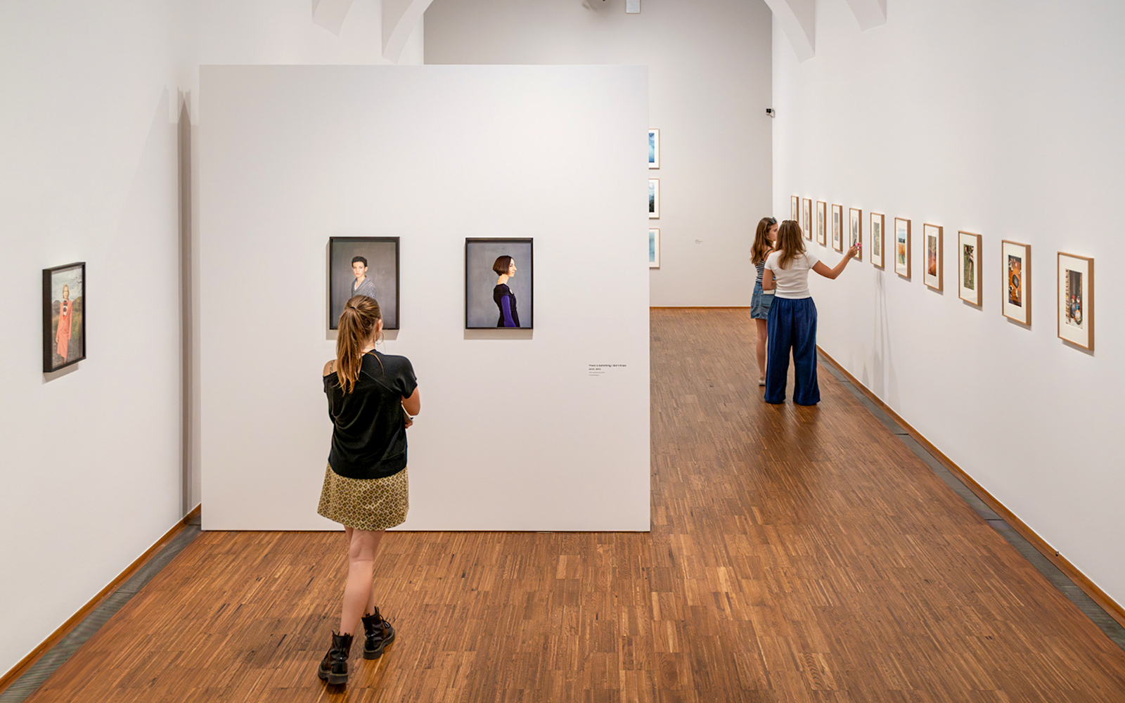 Guests viewing art exhibits inside Albertina Museum, Vienna.