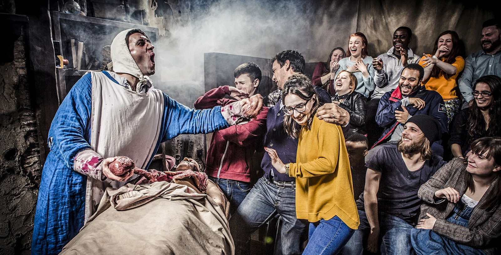 Guests reacting to a live performance at Amsterdam Dungeon.