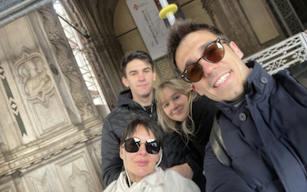 Group exploring historical architecture in Florence during a self-guided haunted city game.