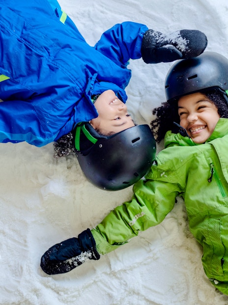 Children making snow angels at Big Snow American Dream.