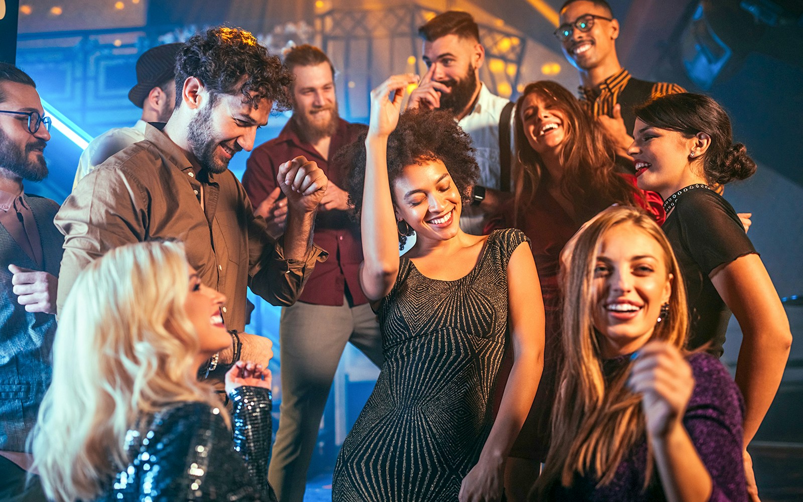 People enjoying a night out dancing at a lively club.