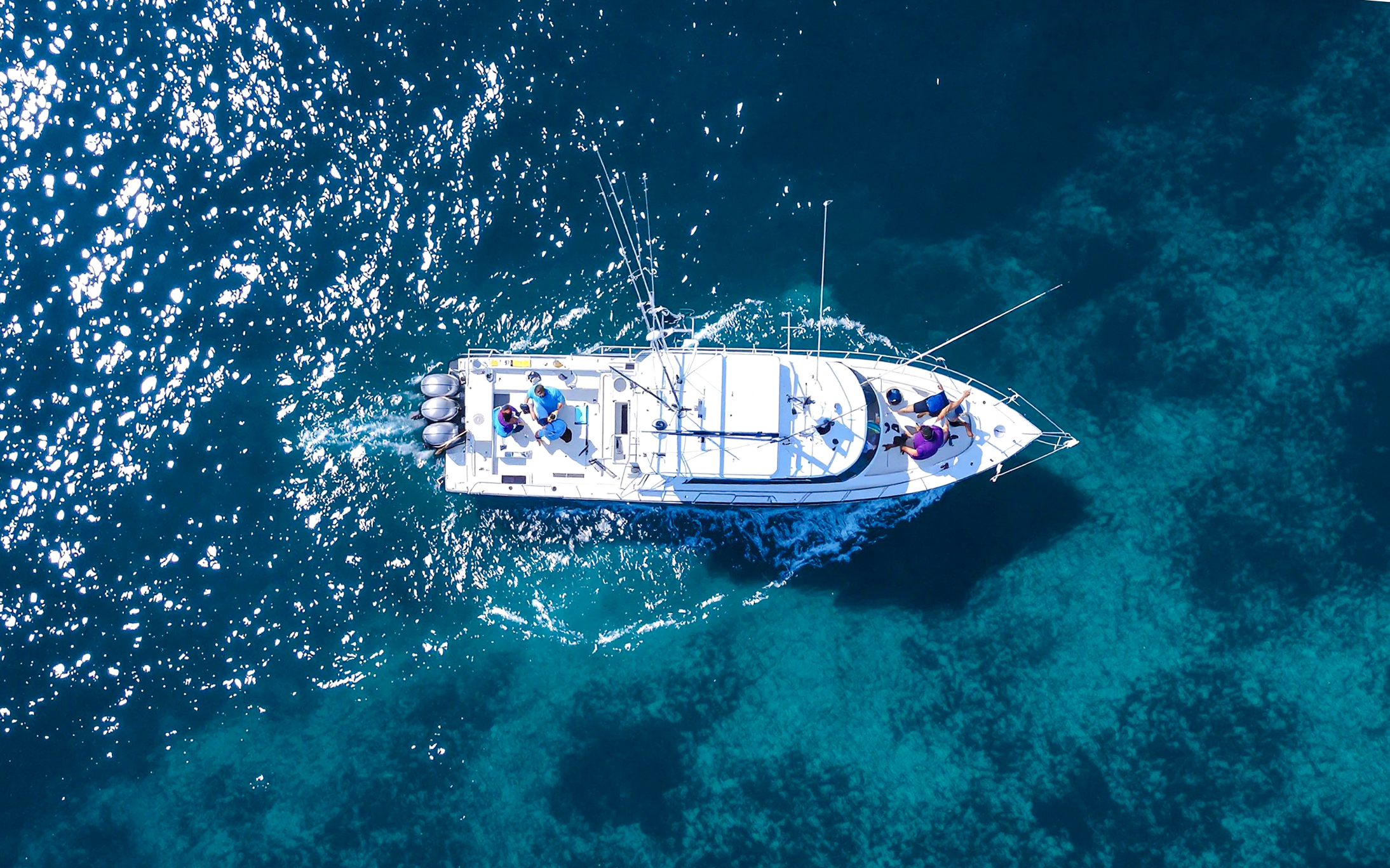 Aerial view of a fishing boat on a sports fishing cruise in Dubai waters.