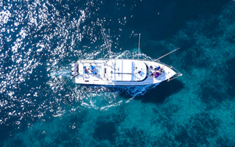Aerial view of a fishing boat on a sports fishing cruise in Dubai waters.