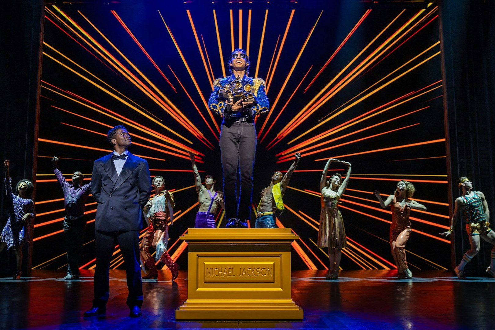 Stage performance of MJ the Musical in Brisbane with dancers and vibrant backdrop.