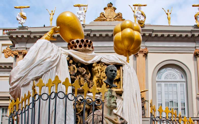 Sculptures on the Dalí Museum facade featuring golden figures and artistic busts.